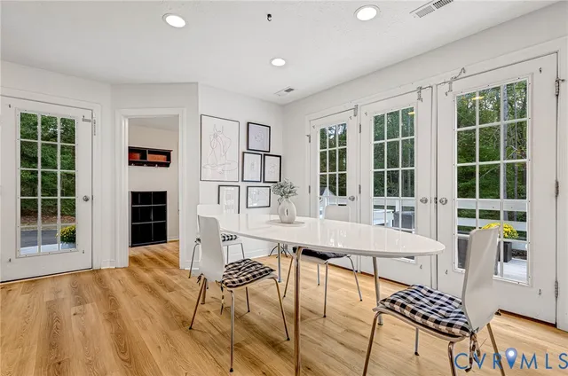 a living room with furniture a window and a kitchen view