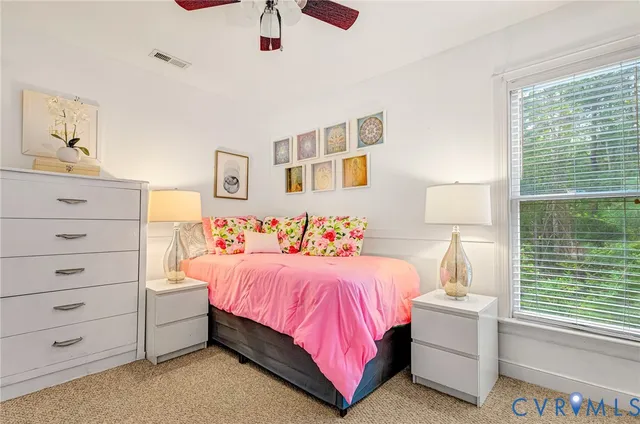a bedroom with a bed and a cabinets