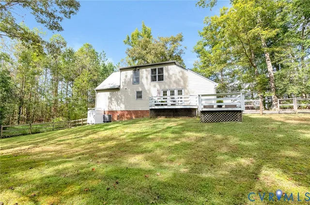 a house view with swimming pool in front of it
