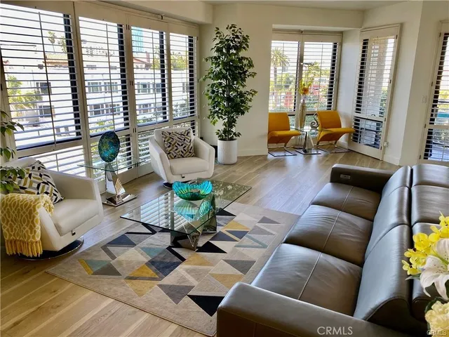 a kitchen with kitchen island granite countertop a sink a stove and cabinets