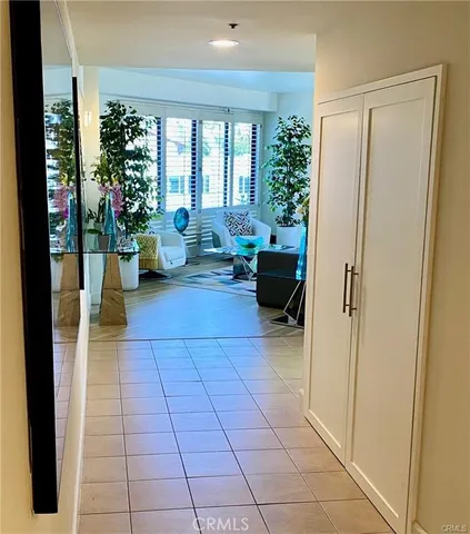 a kitchen with a refrigerator sink and cabinets