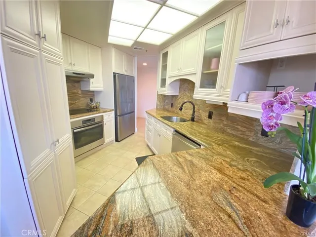 a view of a chairs and table in a balcony