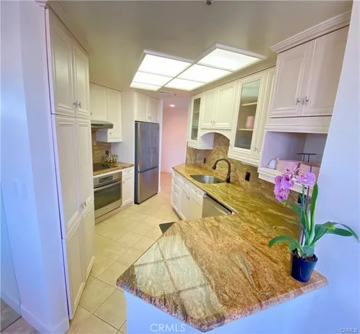 a bedroom with a bed and a night stand