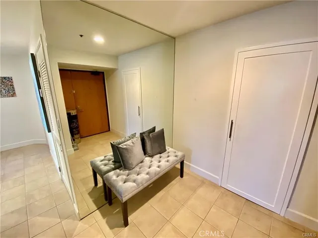 a couch sitting in a bedroom next to a window