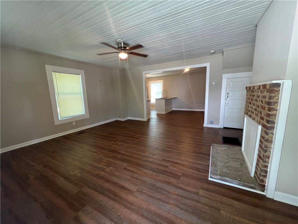48 Quarry Street Gainesville, GA 30501 - Photo 2 of 9 wooden floor in an empty room with a window