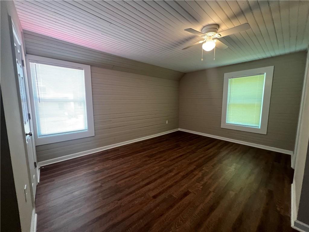48 Quarry Street Gainesville, GA 30501 - Photo 7 of 9 an empty room with wooden floor and windows