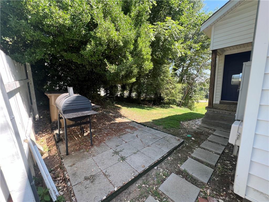 48 Quarry Street Gainesville, GA 30501 - Photo 9 of 9 a view of a backyard with chairs and a patio