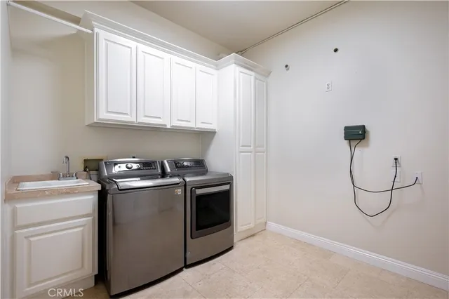 a view of a storage & utility room with washer and dryer