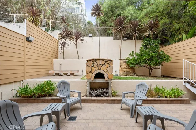 a front view of a house with outdoor seating