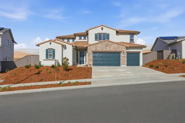 a front view of a house with a yard
