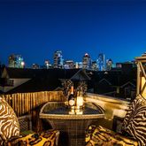 a terrace of a house with outdoor seating
