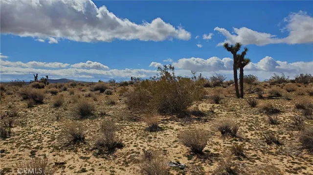 a view of a large window with a mountain in the background