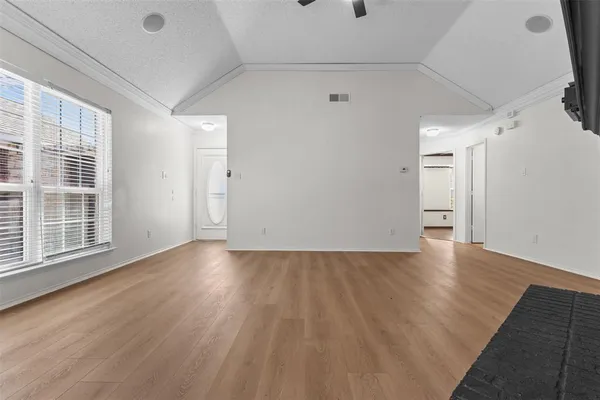 a view of a livingroom with wooden floor