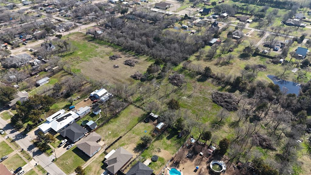 Tbd South Hall Street Ennis, TX 75119 - Photo 7 of 8 an aerial view of residential houses with outdoor space