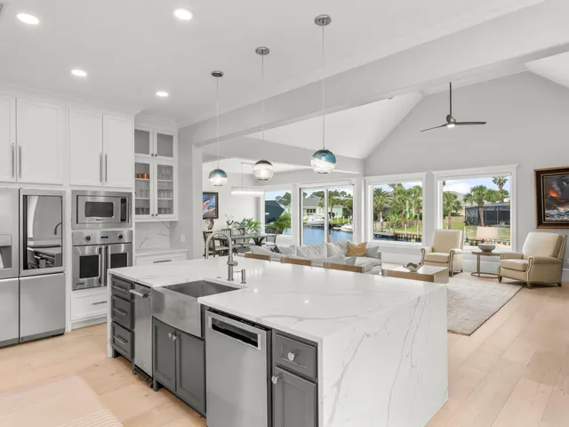 a dining room with furniture a chandelier and window