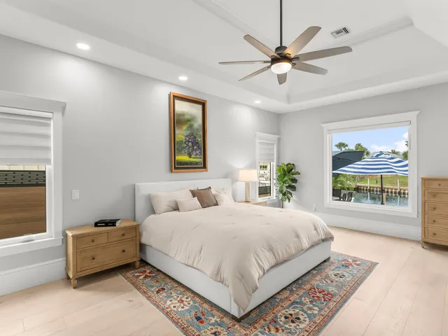 a bedroom with a bed and a dresser