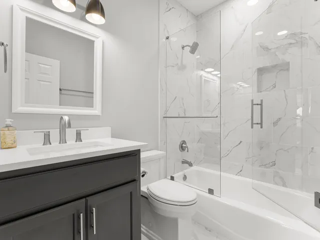 an aerial view of a house with a swimming pool