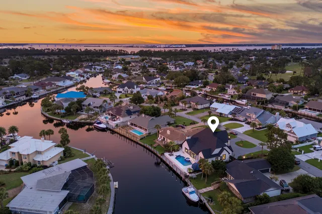 a view of a lake with boats and trees