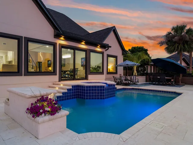 an aerial view of a house with a ocean view