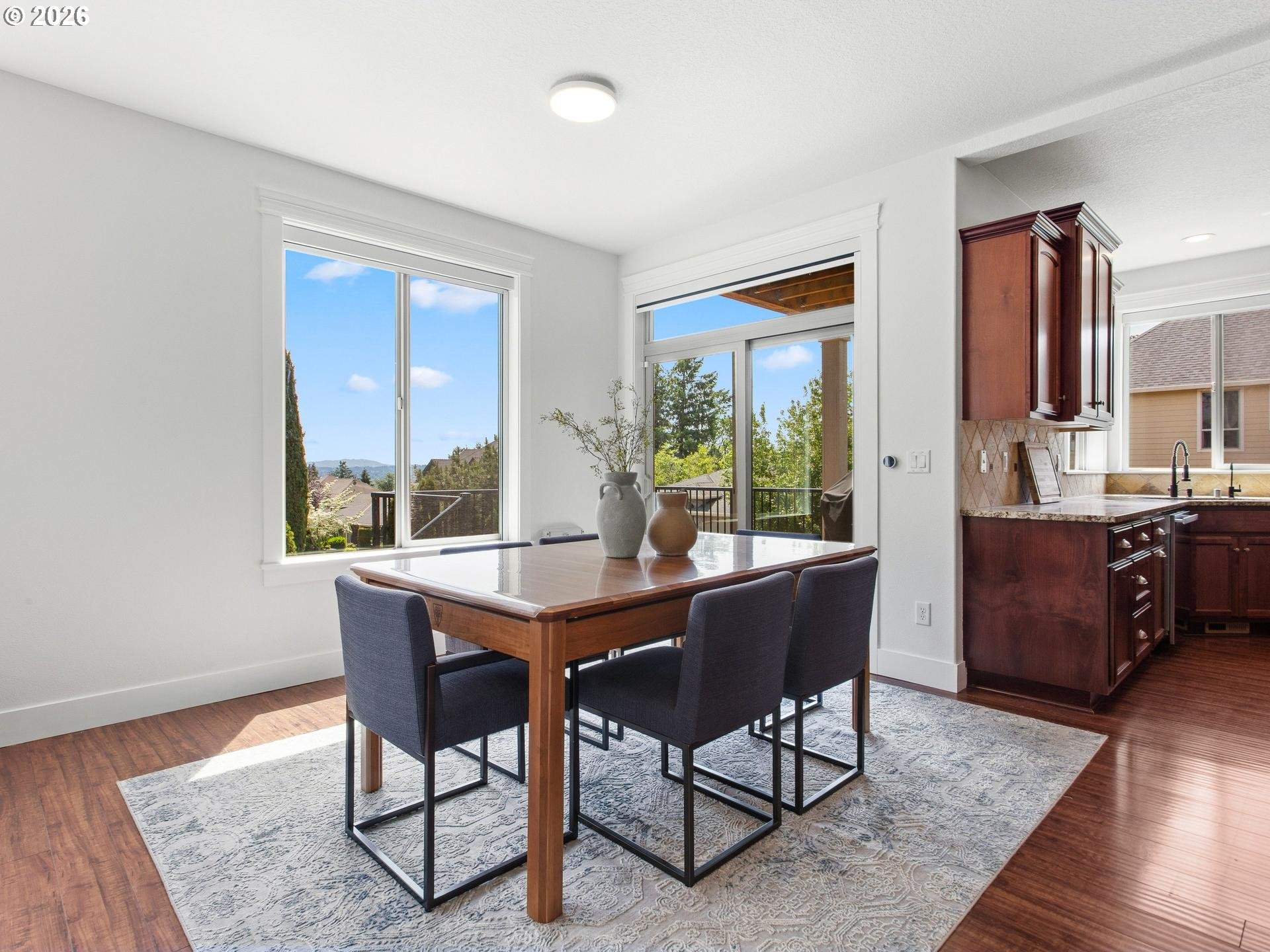 1012 Northwest Goodwin Street Camas, WA 98607 - Photo 12 of 44 a view of a dining room with furniture window and wooden floor
