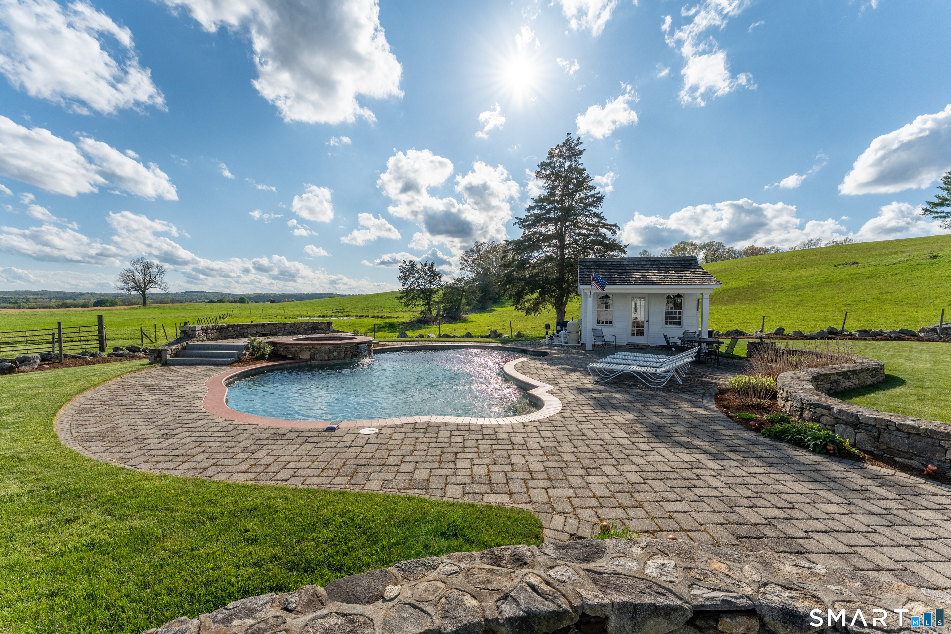 155 Paine Road Woodstock, CT 06281 - Photo 4 of 40 a view of a swimming pool with a patio