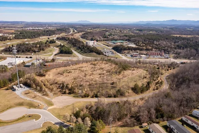 a view of a town with mountains in the background