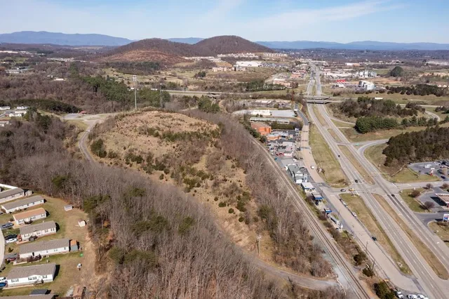 a view of a town with mountains in the background