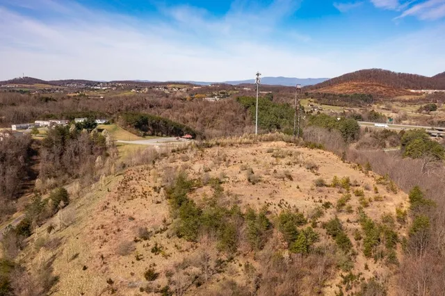 a view of a town with mountains in the background