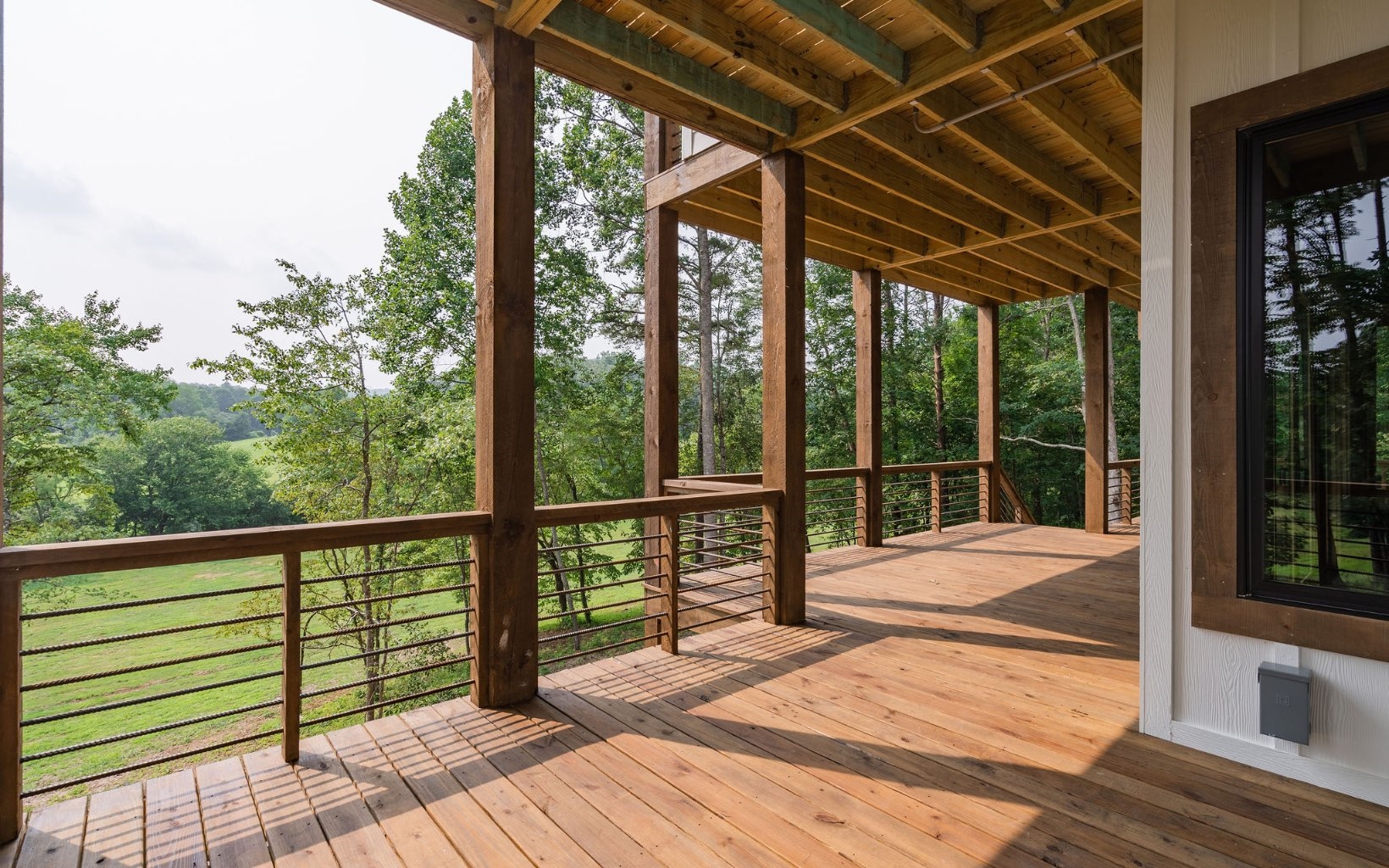 140 Watkins Farm Road Blue Ridge, GA 30513 - Photo 59 of 63 a view of a balcony with wooden floor