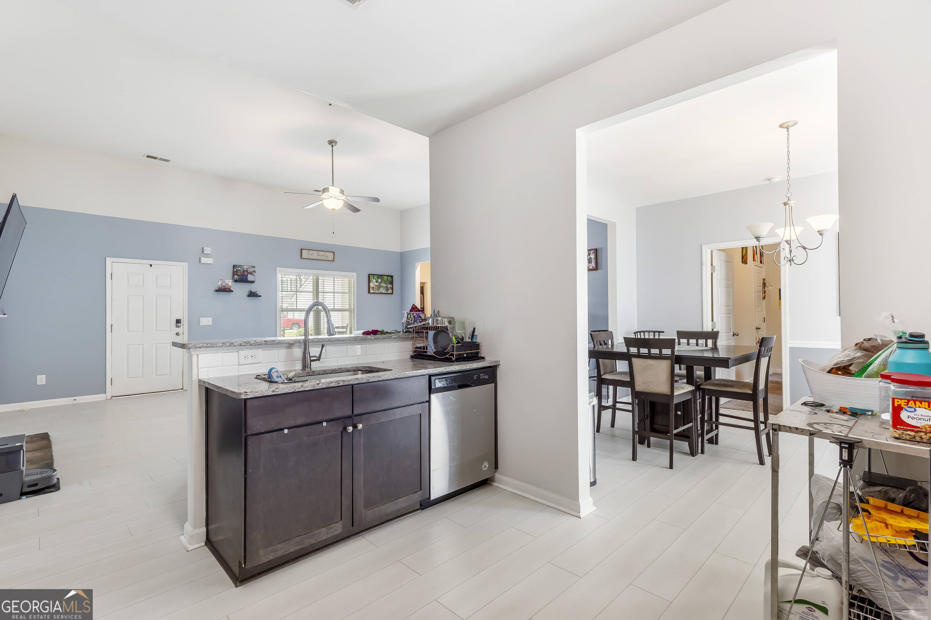 370 Springwater Way Bremen, GA 30110 - Photo 13 of 32 a kitchen with stainless steel appliances granite countertop a table and chairs in it