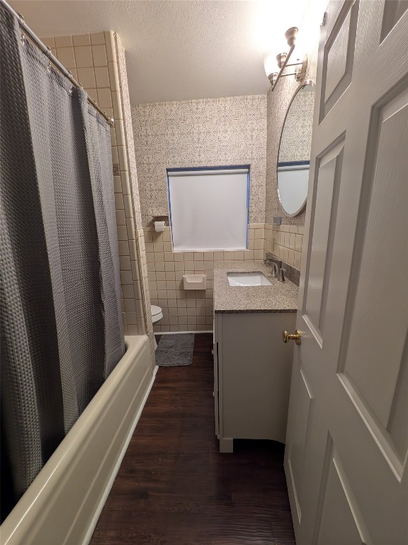 2204 Forest Trail Austin, TX 78703 - Photo 12 of 15 a bathroom with sink a mirror a vanity and a shower