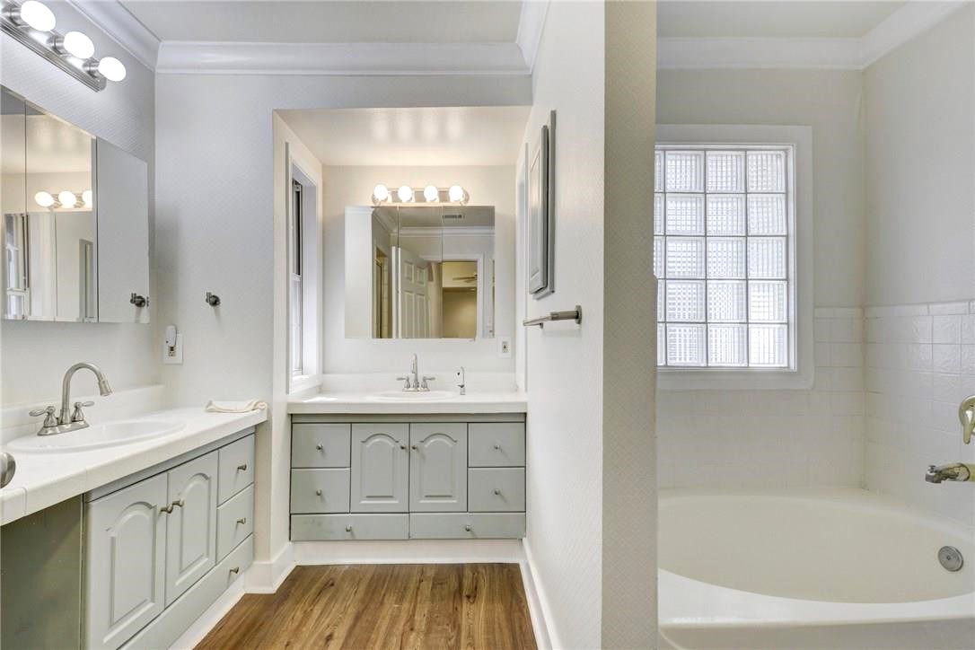 2204 Forest Trail Austin, TX 78703 - Photo 5 of 15 a bathroom with a tub sink and mirror