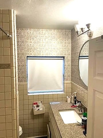 2204 Forest Trail Austin, TX 78703 - Photo 6 of 15 a bathroom with a granite countertop sink and a mirror