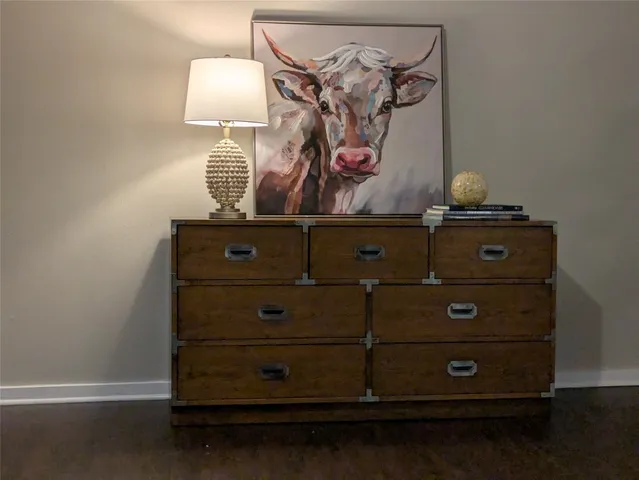 a view of a dresser with wooden floor