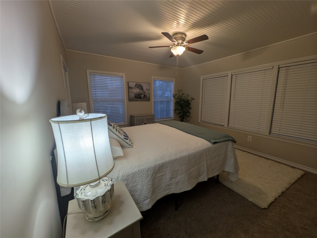 2204 Forest Trail Austin, TX 78703 - Photo 10 of 15 a bedroom with a bed and mirror