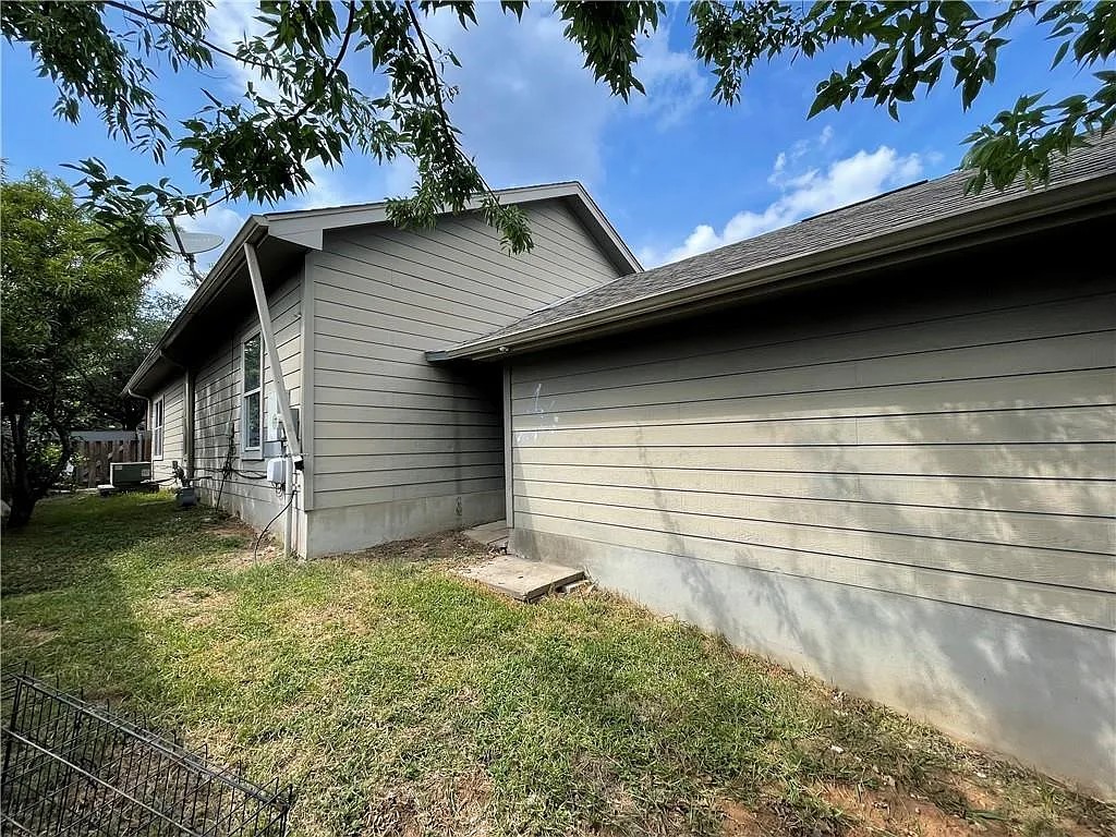 5701 Signal Point Austin, TX 78724 - Photo 12 of 12 Exterior siding featuring horizontal panels and a visible foundation