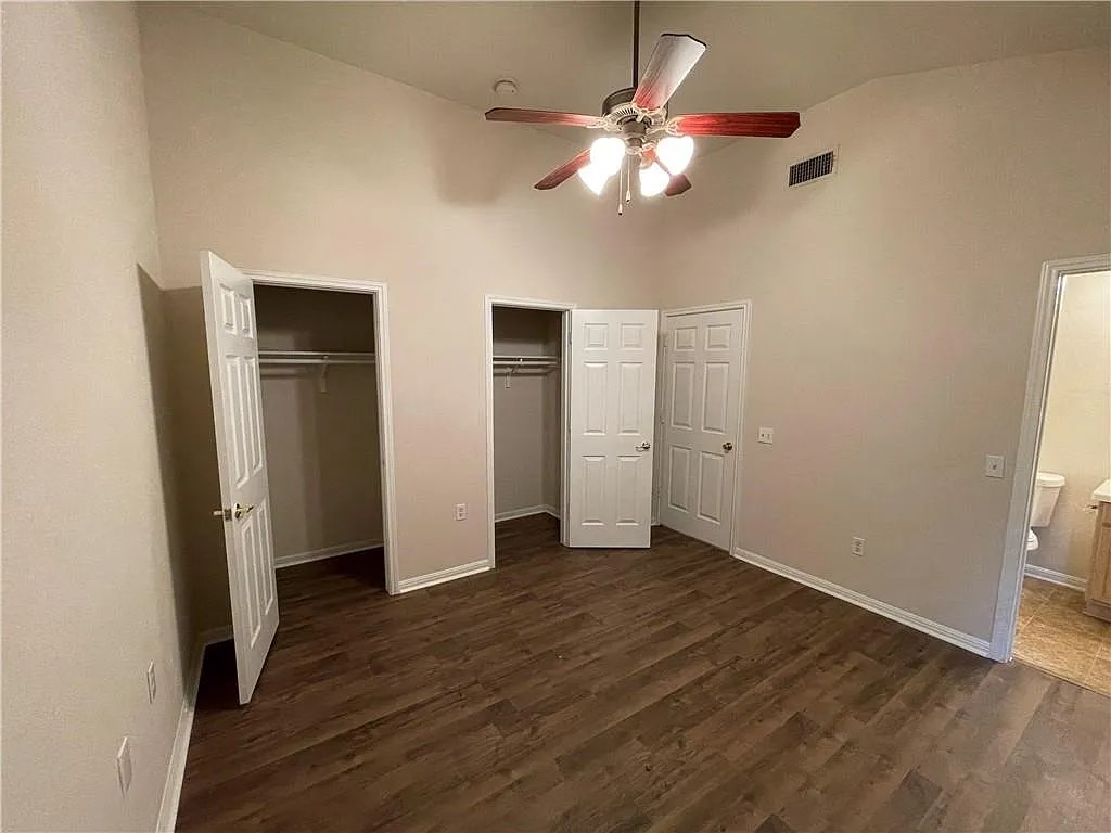 5701 Signal Point Austin, TX 78724 - Photo 9 of 12 Spacious room featuring vaulted ceilings and wood-finish flooring