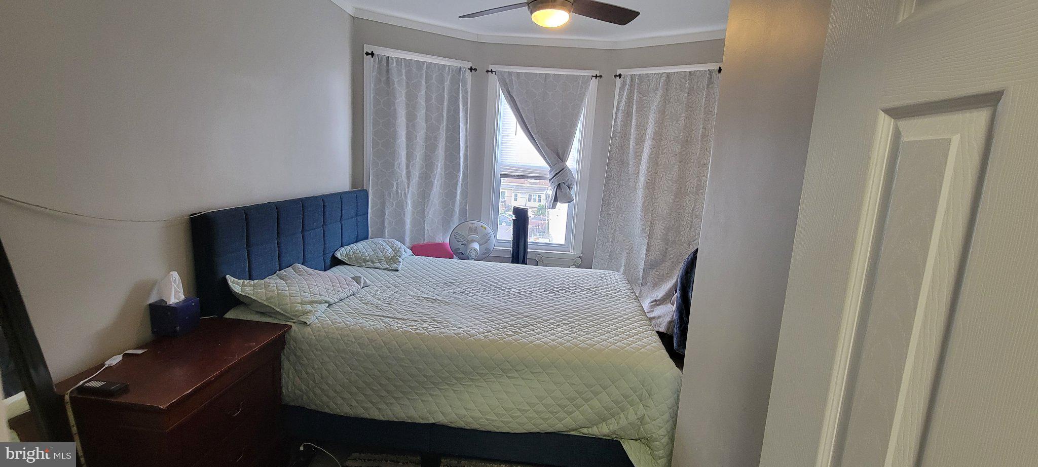 209 North 10th Street Darby, PA 19023 - Photo 20 of 26 Cozy bedroom with natural light.