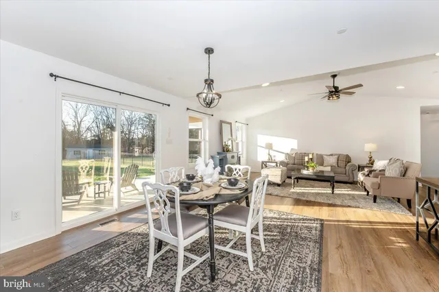 a kitchen with a sink a counter top space stainless steel appliances and cabinets