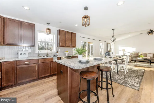 a kitchen with a sink a cabinets and a stove