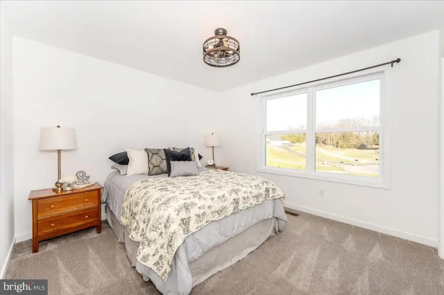 a view of a patio with table and chairs
