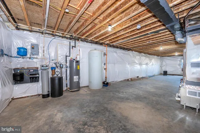 a front view of a house with a yard table and chairs