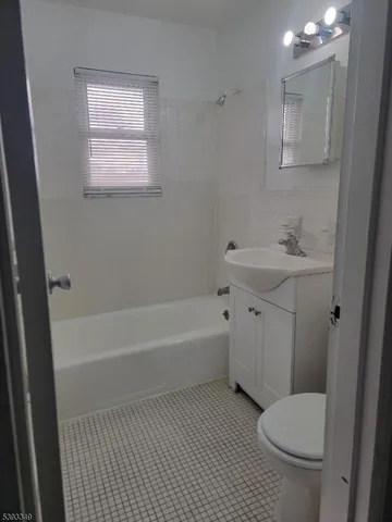 a bathroom with a sink toilet and bathtub