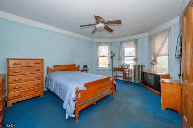 a bedroom with a bed and furniture