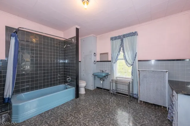 a bathroom with a bathtub sink and toilet