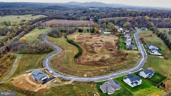 an aerial view of a house with outdoor space