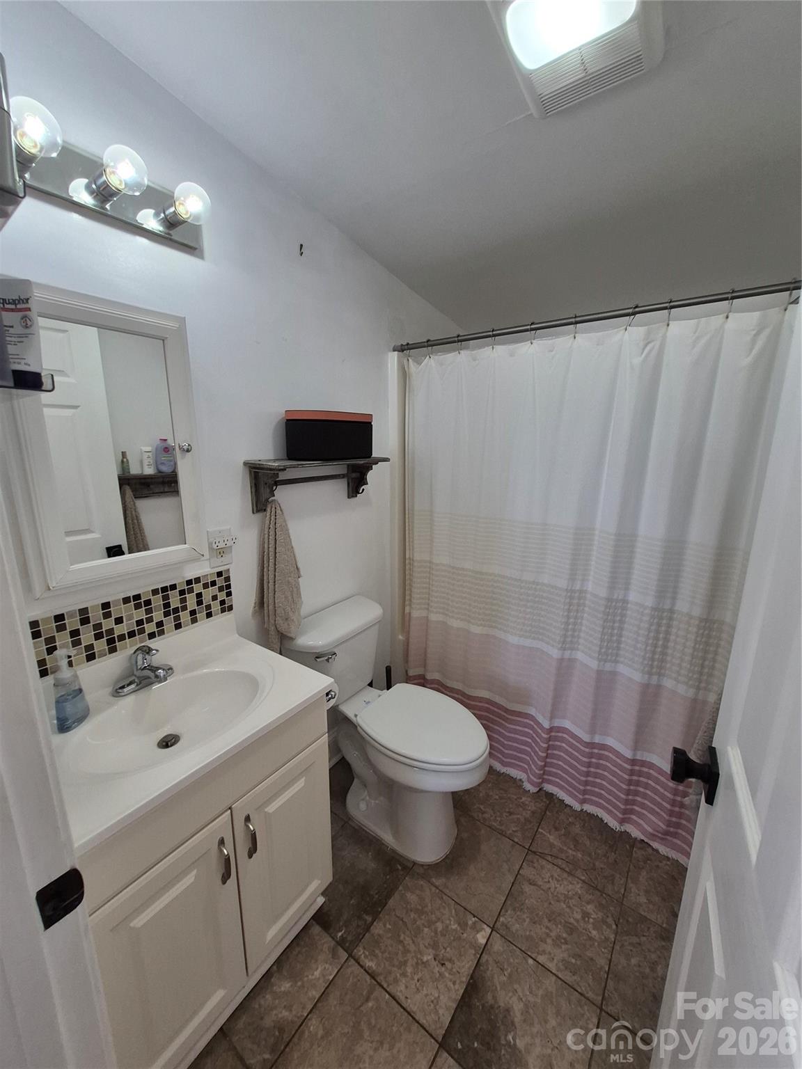 4438 Reepsville Road Vale, NC 28168 - Photo 30 of 32 a bathroom with a sink toilet and shower