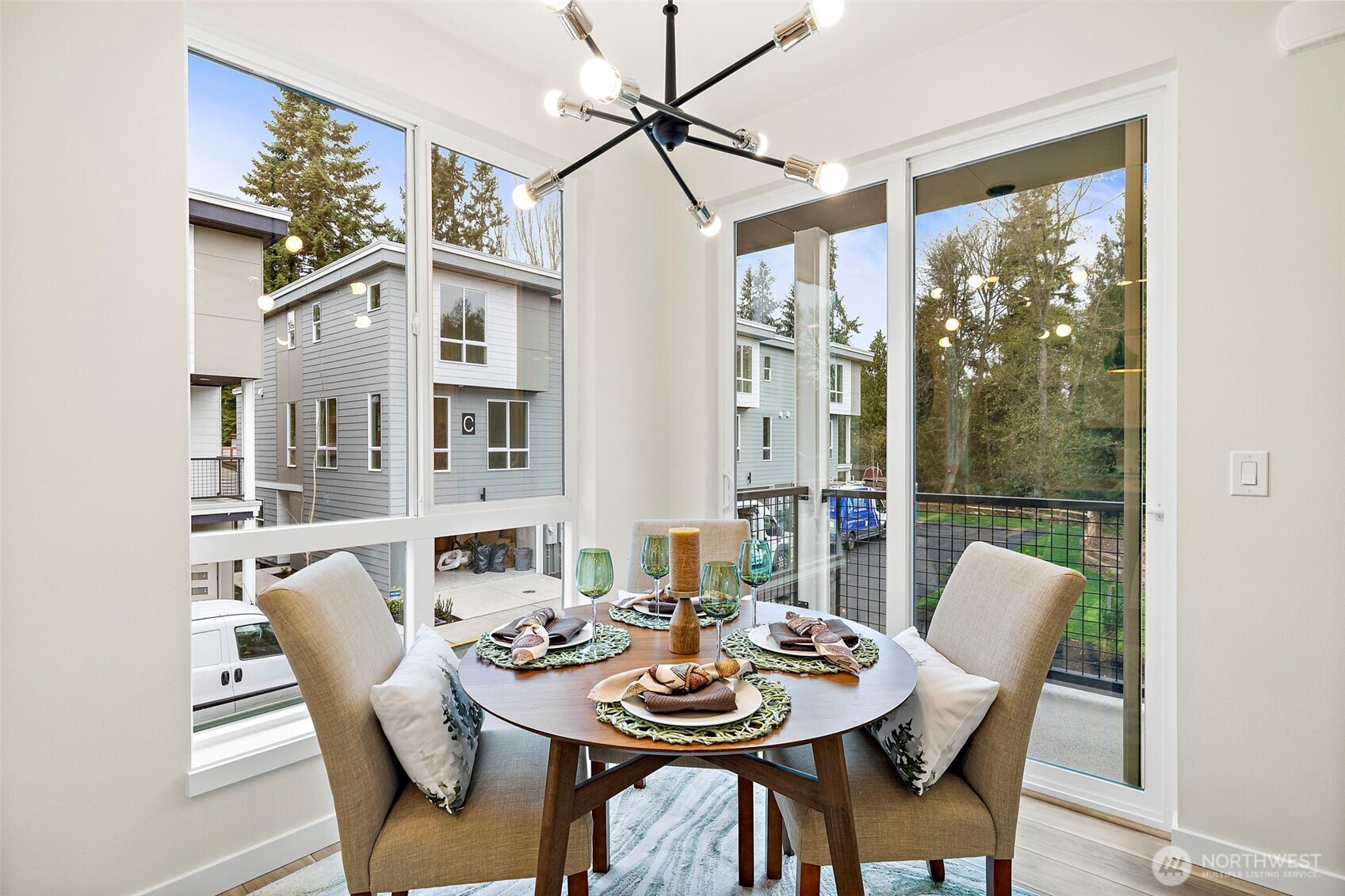 5015 144th Street Southwest, Unit C3 Edmonds, WA 98026 - Photo 12 of 30 a dining room with furniture large windows and wooden floor