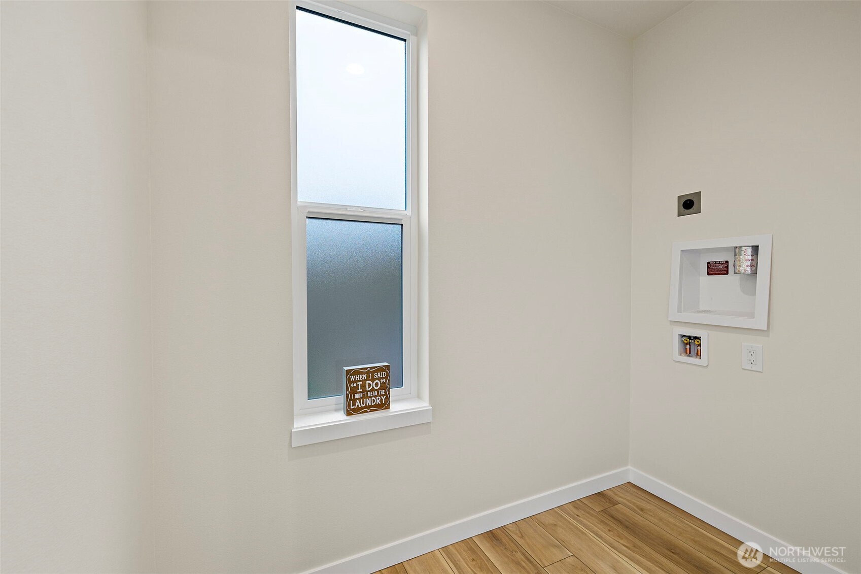 5015 144th Street Southwest, Unit C3 Edmonds, WA 98026 - Photo 20 of 30 a view of an empty room with wooden floor and a window
