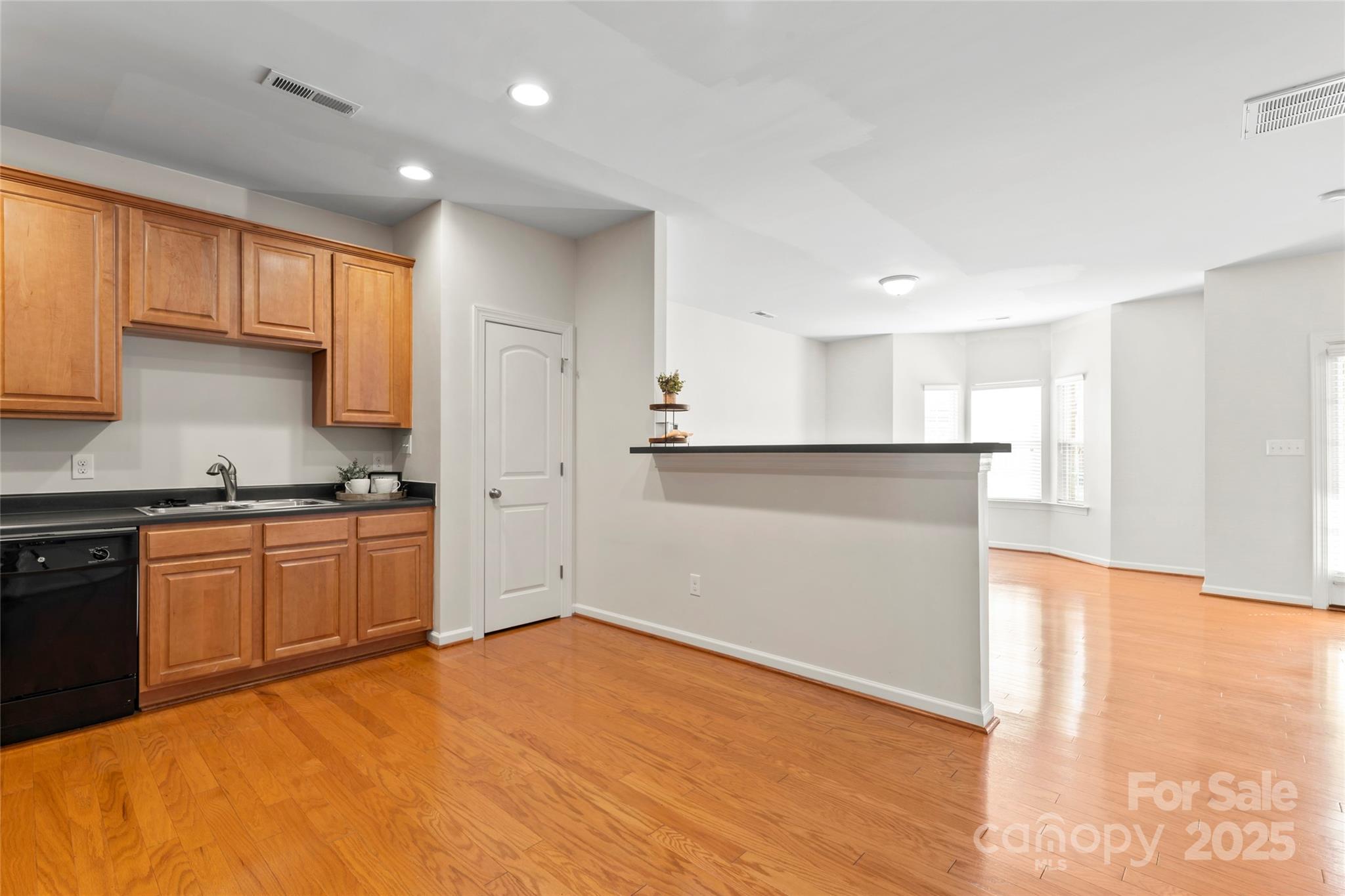 5678 Stafford Road Charlotte, NC 28215 - Photo 13 of 43 a kitchen with granite countertop a refrigerator and a sink